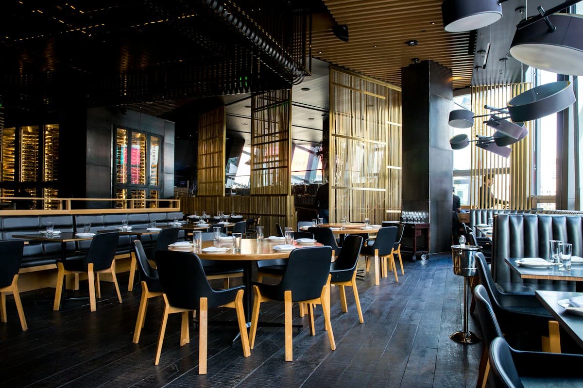 An inviting dining room filled with wooden tables and warm light